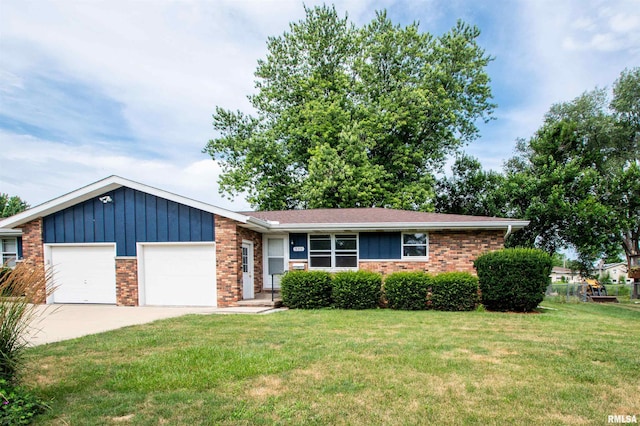 339 N Dr, Morton, IL 61550 - ranch-style house with brick siding, an attached garage, a front yard, concrete driveway, and board and batten siding