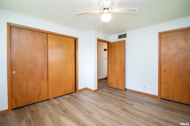 339 N Dr, Morton, IL 61550 - unfurnished bedroom with light wood-style flooring, a closet, and ceiling fan