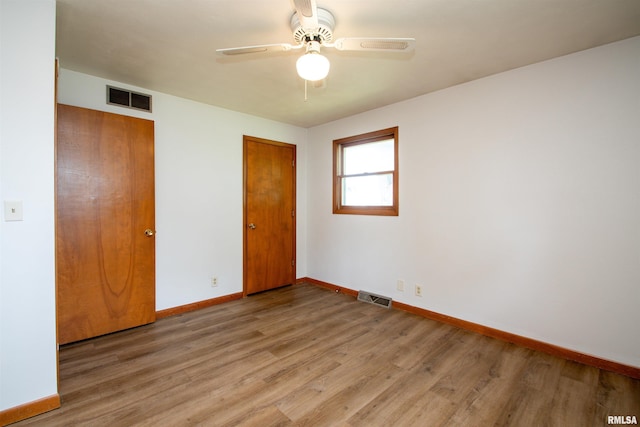 339 N Dr, Morton, IL 61550 - unfurnished bedroom featuring wood finished floors, a ceiling fan, and a closet