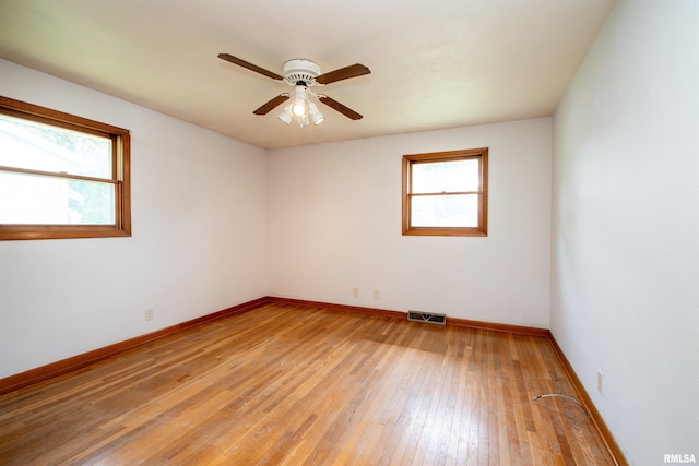 339 N Dr, Morton, IL 61550 - empty room with plenty of natural light, light wood-style flooring, and a ceiling fan
