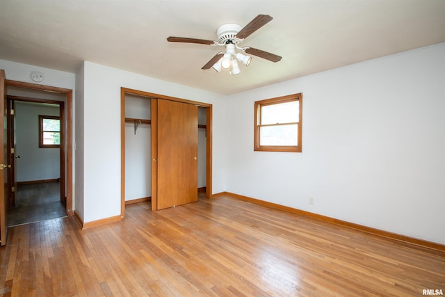 339 N Dr, Morton, IL 61550 - unfurnished bedroom with light wood-style flooring, a closet, and ceiling fan