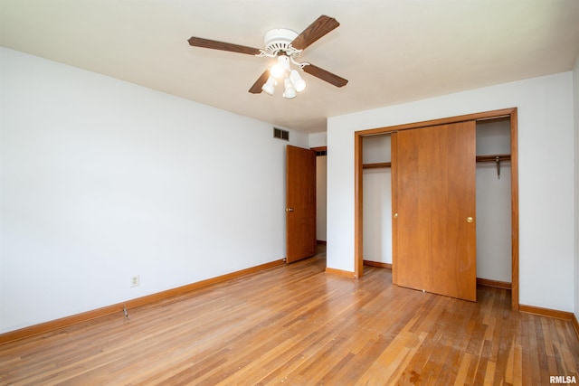 339 N Dr, Morton, IL 61550 - unfurnished bedroom featuring light wood-style flooring, a closet, and a ceiling fan