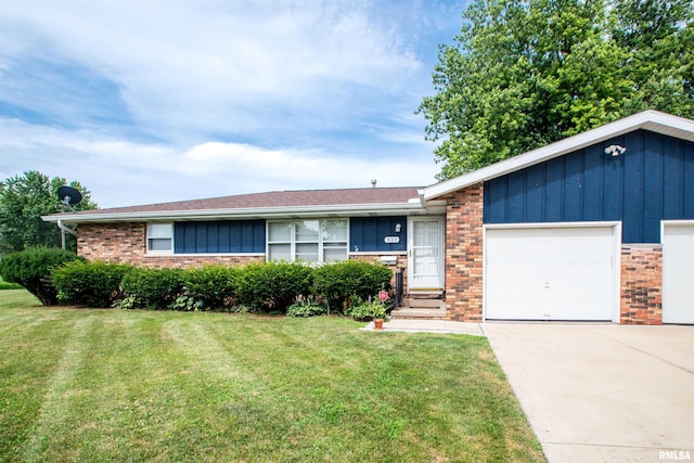 337 N Dr, Morton, IL 61550 - ranch-style house with brick siding, a front yard, concrete driveway, and an attached garage