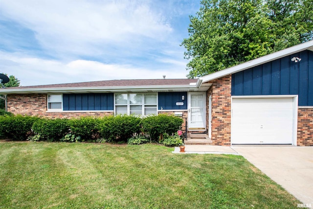 337 N Dr, Morton, IL 61550 - ranch-style house featuring brick siding, a garage, concrete driveway, and a front lawn