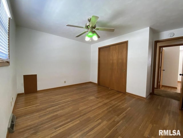 337 N Dr, Morton, IL 61550 - unfurnished bedroom with wood-type flooring, a closet, and a ceiling fan