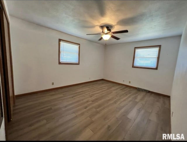 337 N Dr, Morton, IL 61550 - spare room with healthy amount of natural light, a ceiling fan, and wood finished floors