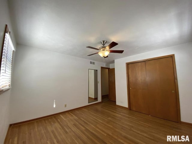 337 N Dr, Morton, IL 61550 - unfurnished bedroom featuring wood finished floors and a ceiling fan