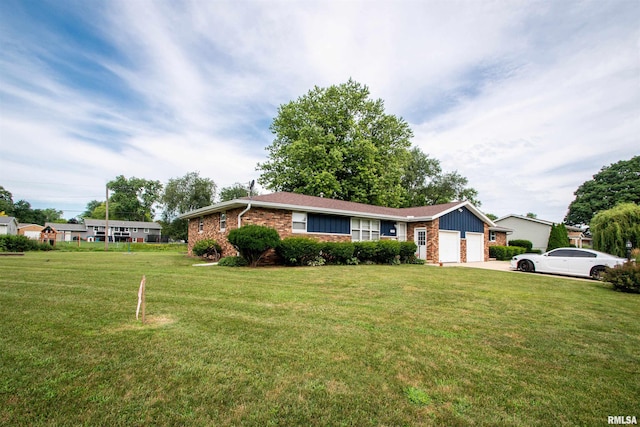 337 N Dr, Morton, IL 61550 - ranch-style home with brick siding, a front yard, an attached garage, and concrete driveway