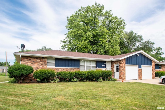 337 N Dr, Morton, IL 61550 - single story home with an attached garage, brick siding, a front yard, board and batten siding, and concrete driveway