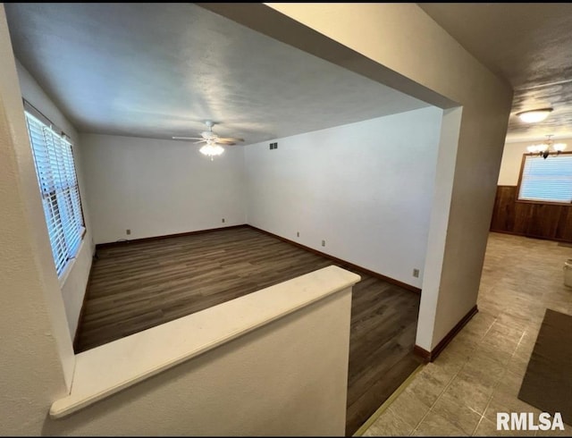 337 N Dr, Morton, IL 61550 - unfurnished room with ceiling fan, a chandelier, and wood finished floors