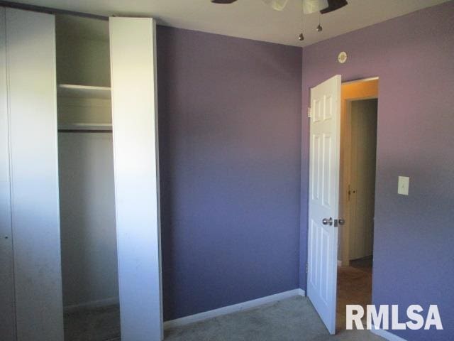 203 Arrow St, Pekin, IL 61554 - unfurnished bedroom with carpet floors and a closet