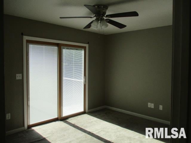 203 Arrow St, Pekin, IL 61554 - carpeted empty room featuring healthy amount of natural light and ceiling fan