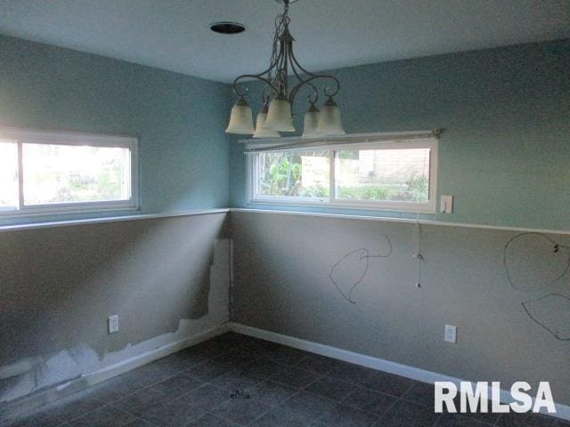 203 Arrow St, Pekin, IL 61554 - unfurnished room with a chandelier and plenty of natural light