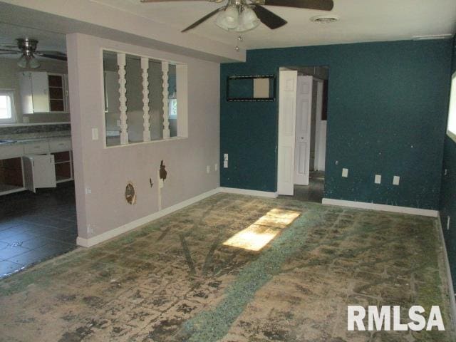 203 Arrow St, Pekin, IL 61554 - unfurnished room with a ceiling fan and baseboards