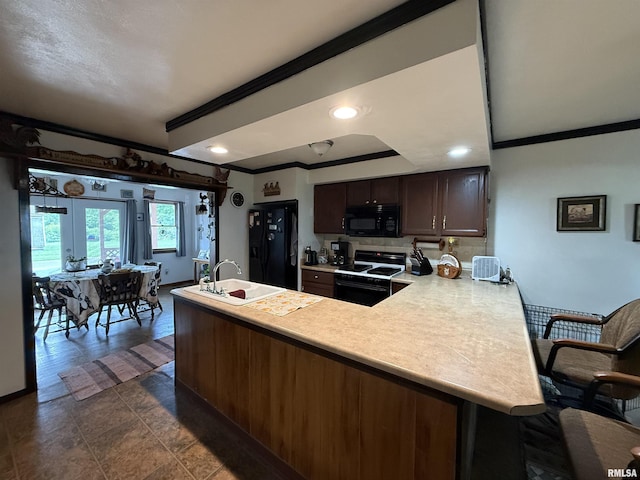 628 E Macarthur Ave, Lewistown, IL 61542 - kitchen with black appliances, crown molding, light countertops, a peninsula, and dark brown cabinets