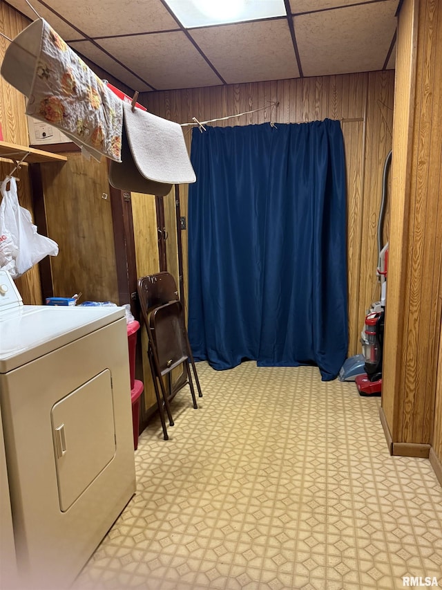 628 E Macarthur Ave, Lewistown, IL 61542 - washroom with washer / dryer, light flooring, and wood walls