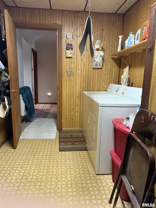 628 E Macarthur Ave, Lewistown, IL 61542 - laundry room with light flooring, wooden walls, and washer and dryer