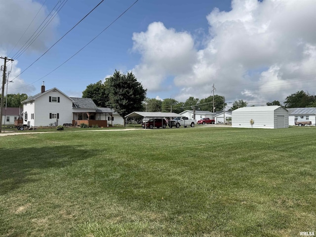 628 E Macarthur Ave, Lewistown, IL 61542 - view of grassy yard with a carport