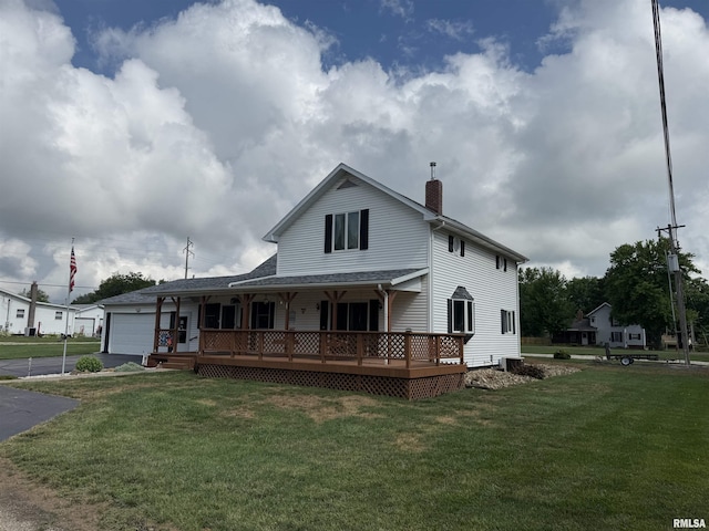 628 E Macarthur Ave, Lewistown, IL 61542 - view of front of home with a chimney, a front lawn, covered porch, and driveway