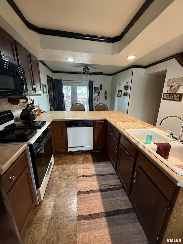 628 E Macarthur Ave, Lewistown, IL 61542 - kitchen featuring black appliances, ornamental molding, light countertops, ceiling fan, and a tray ceiling