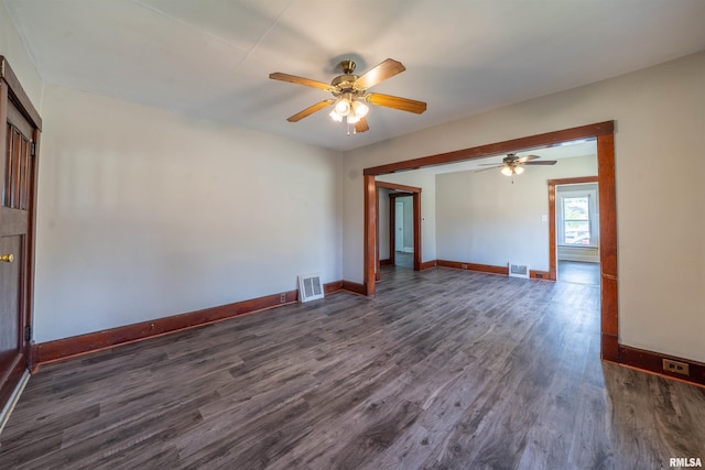 339 Herman St, Pekin, IL 61554 - empty room featuring dark wood-type flooring and a ceiling fan