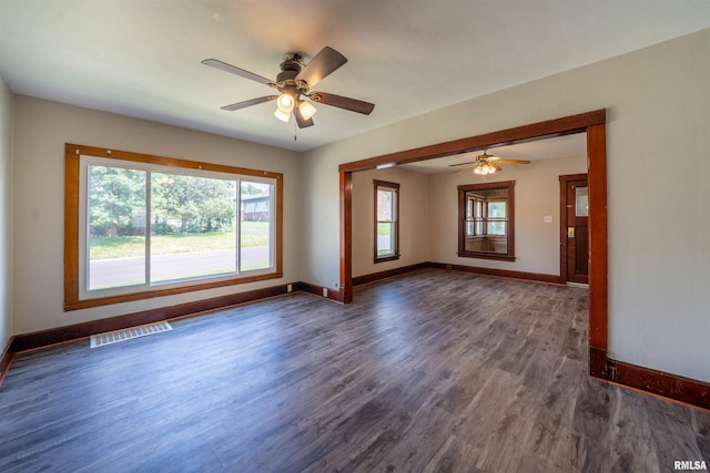 339 Herman St, Pekin, IL 61554 - empty room featuring plenty of natural light, dark wood-style flooring, and ceiling fan