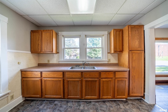 339 Herman St, Pekin, IL 61554 - kitchen with brown cabinets, a paneled ceiling, and plenty of natural light