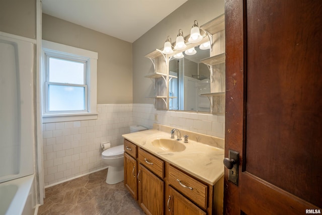339 Herman St, Pekin, IL 61554 - bathroom with vanity, tile walls, and wainscoting