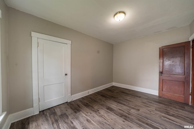 339 Herman St, Pekin, IL 61554 - unfurnished room featuring dark wood-type flooring and baseboards
