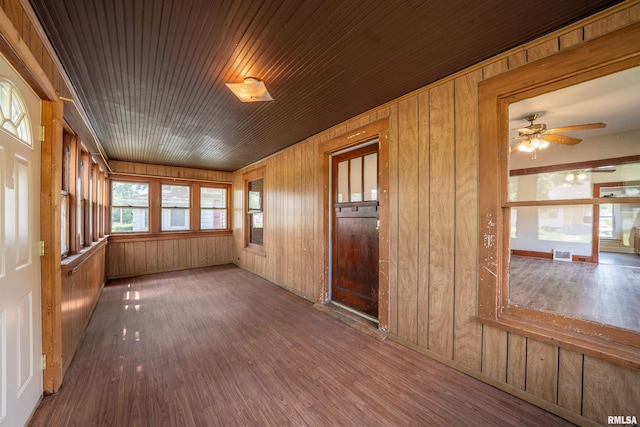 339 Herman St, Pekin, IL 61554 - unfurnished room featuring wood finished floors, wooden walls, and a ceiling fan