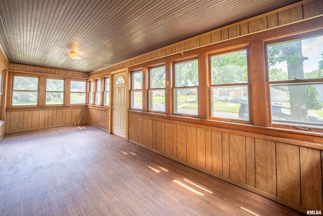 339 Herman St, Pekin, IL 61554 - unfurnished sunroom featuring wood walls and wood finished floors