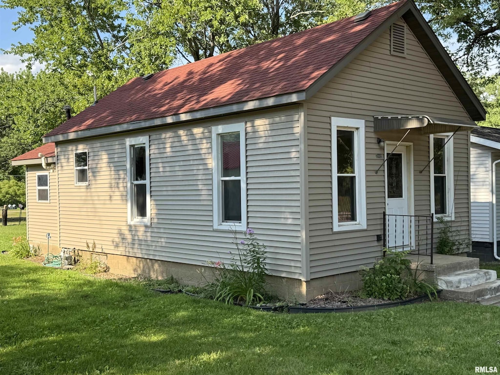 202 Ferry St, Sparland, IL 61565 - view of home's exterior with roof with shingles and a lawn