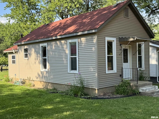 202 Ferry St, Sparland, IL 61565 - view of home's exterior with roof with shingles and a lawn