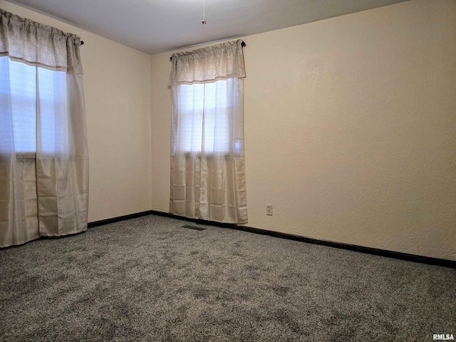 403 Koch St, Pekin, IL 61554 - unfurnished room featuring carpet and a textured wall