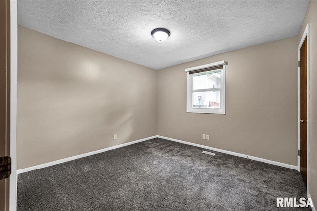 303 W 3rd Ave, Deer Creek, IL 61733 - unfurnished bedroom with carpet floors and a textured ceiling