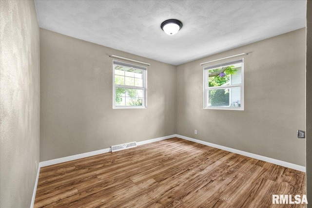 303 W 3rd Ave, Deer Creek, IL 61733 - empty room featuring wood finished floors and baseboards