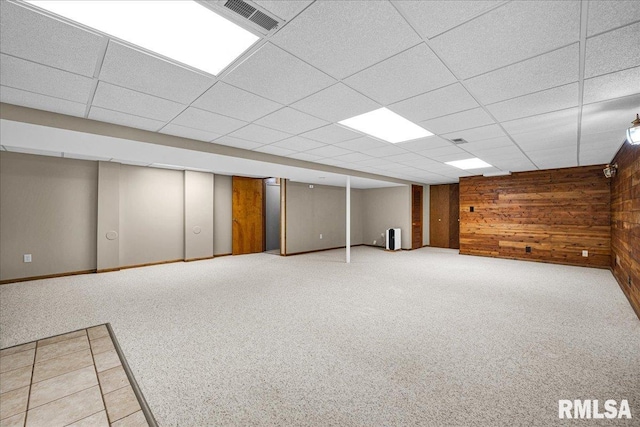 303 W 3rd Ave, Deer Creek, IL 61733 - finished basement featuring wooden walls, carpet floors, and a drop ceiling