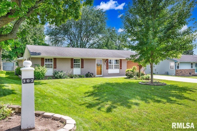 303 W 3rd Ave, Deer Creek, IL 61733 - single story home with a front yard and brick siding