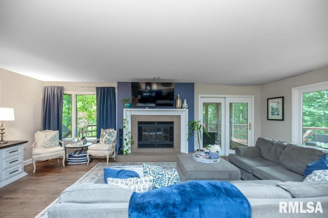 408 W Ravinwoods Rd, Peoria, IL 61615 - living area with wood finished floors and a fireplace with flush hearth