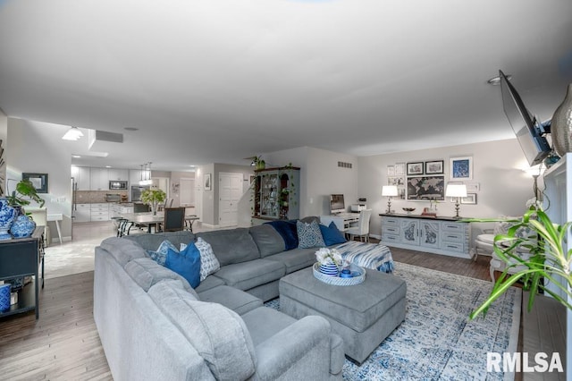 408 W Ravinwoods Rd, Peoria, IL 61615 - living room with light wood-style flooring