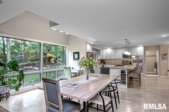 408 W Ravinwoods Rd, Peoria, IL 61615 - dining area with light tile patterned floors and recessed lighting