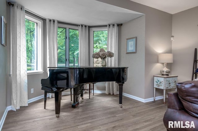 408 W Ravinwoods Rd, Peoria, IL 61615 - sitting room with healthy amount of natural light and wood finished floors