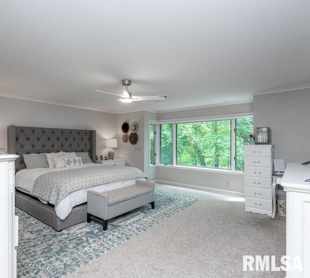408 W Ravinwoods Rd, Peoria, IL 61615 - bedroom with carpet flooring, ornamental molding, and ceiling fan