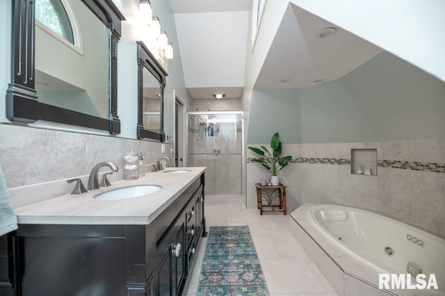 408 W Ravinwoods Rd, Peoria, IL 61615 - full bathroom with tile walls, a shower stall, double vanity, a tub with jets, and tile patterned flooring