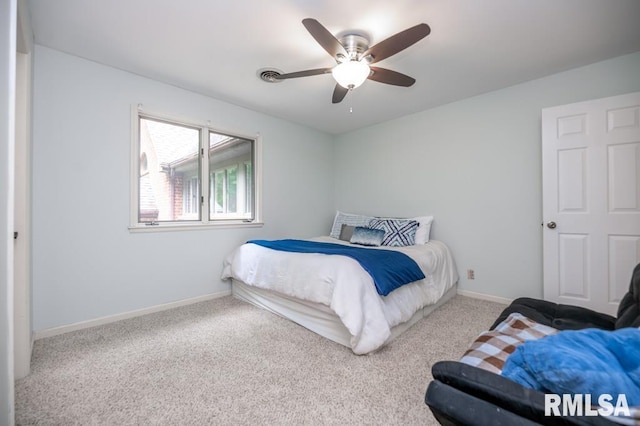 408 W Ravinwoods Rd, Peoria, IL 61615 - bedroom with carpet floors and ceiling fan
