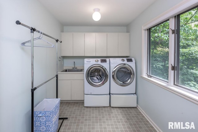 408 W Ravinwoods Rd, Peoria, IL 61615 - laundry room with separate washer and dryer, plenty of natural light, and cabinet space