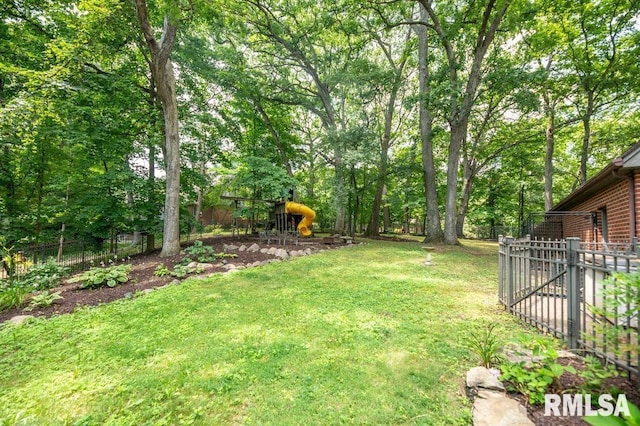408 W Ravinwoods Rd, Peoria, IL 61615 - view of yard with a playground