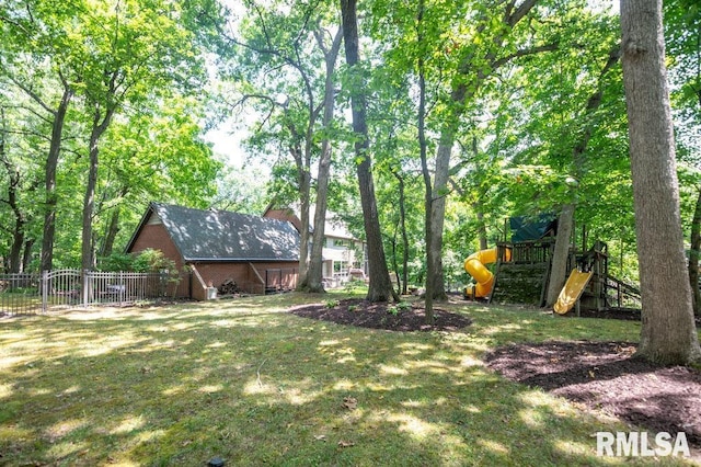 408 W Ravinwoods Rd, Peoria, IL 61615 - view of yard featuring a playground