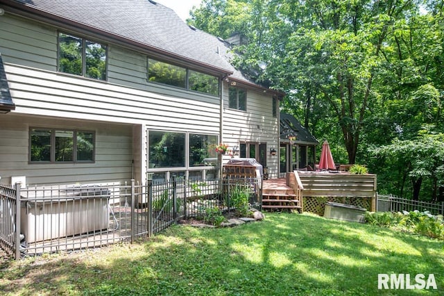408 W Ravinwoods Rd, Peoria, IL 61615 - rear view of property with roof with shingles and a wooden deck