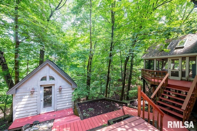 408 W Ravinwoods Rd, Peoria, IL 61615 - wooden terrace featuring stairway and a view of trees